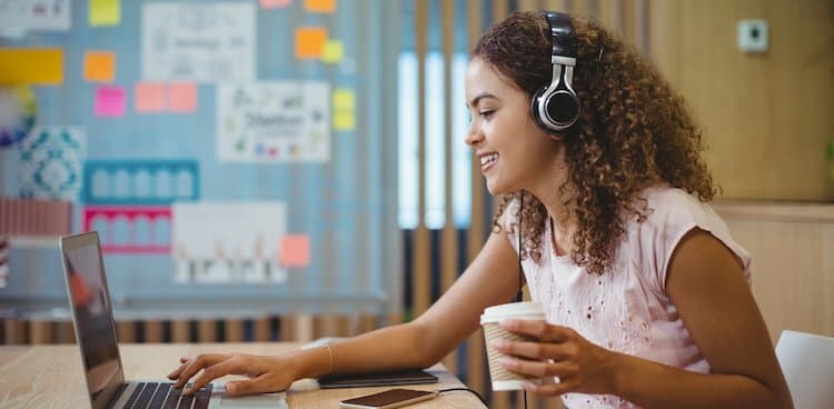 person on laptop sitting in classroom