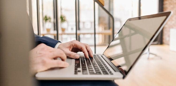 typing on laptop